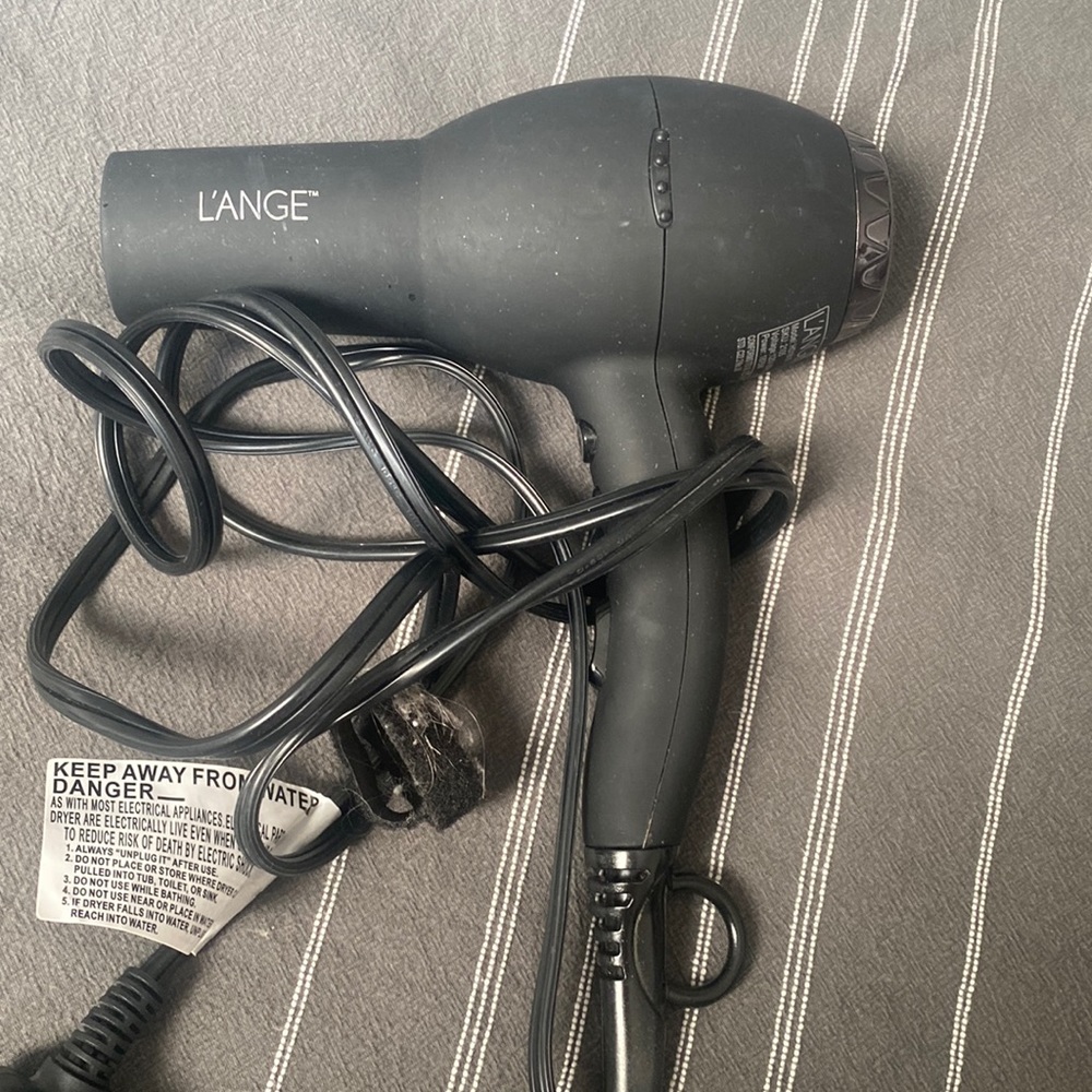 Lange Soleil hair dryer. Used twice for travel. Excellent hairdryer. Like new.